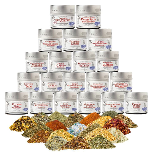 Set of 20 tins of Gustus Vitae luxury pantry seasonings and sea salts, neatly arranged in a collection gift set.