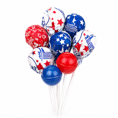 Assorted Tootsie Roll Pop Patriotic lollipops in red, white, and blue colors from Candy In Bulk, displayed in a bulk value bag.