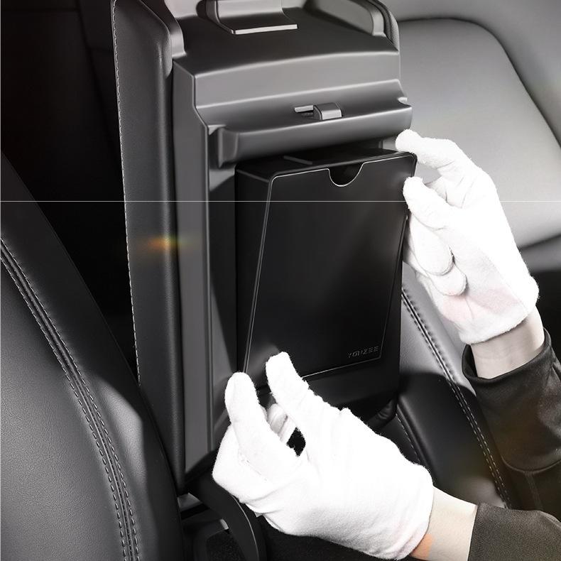 Magnetic hidden center console storage box for Tesla Model Y Juniper and Model 3 Highland, designed for organized interior storage.