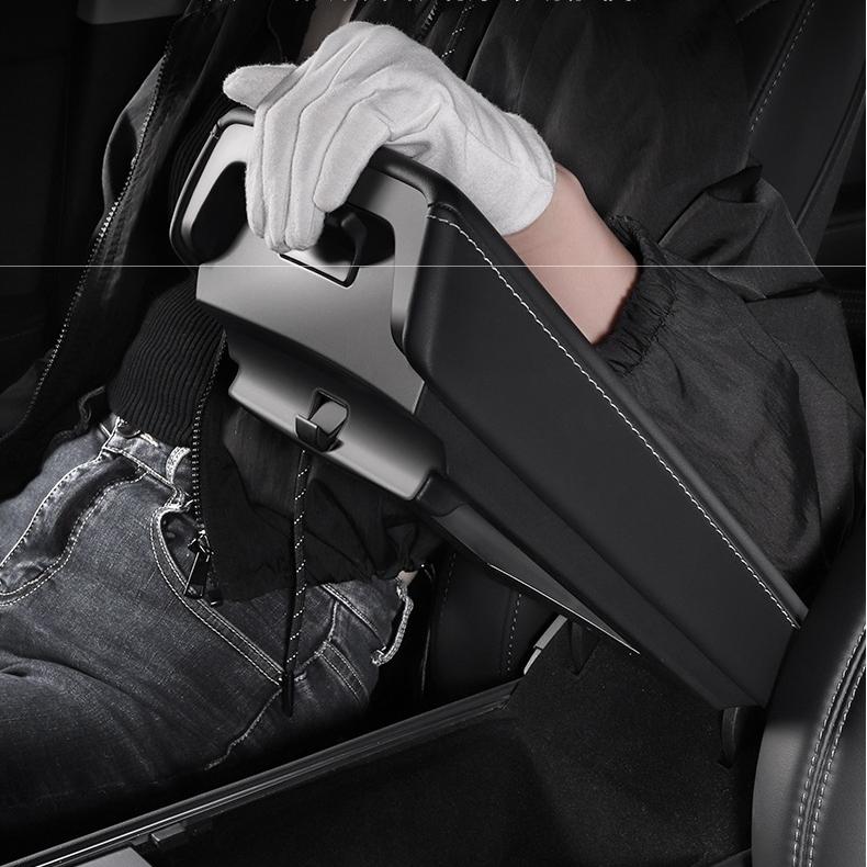 Magnetic hidden center console organizer storage box for Tesla Model Y Juniper and Model 3 Highland, keeps items tidy inside the car.