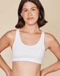 Black Meadow Glide Cotton Racerback Bralette sports bra with seamless design and supportive fit, shown on a small mannequin.