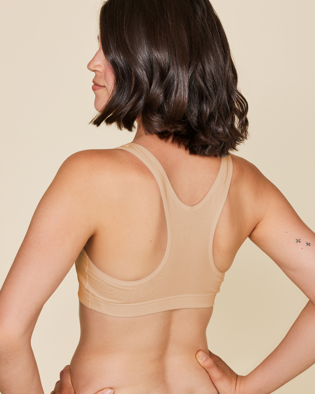 Black Meadow Glide Cotton Racerback Bralette, a comfortable sports bra with a seamless racerback design.