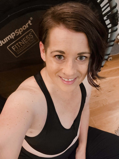 Black Meadow front-closure sports bra with supportive design, featuring adjustable straps and breathable fabric for active wear.
