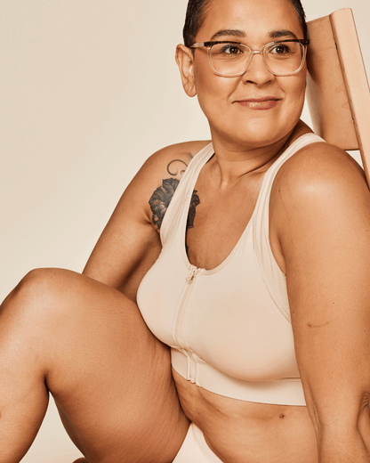 Meadow Hero front-closure sports bra in buff color, featuring supportive design and adjustable straps for active wear.