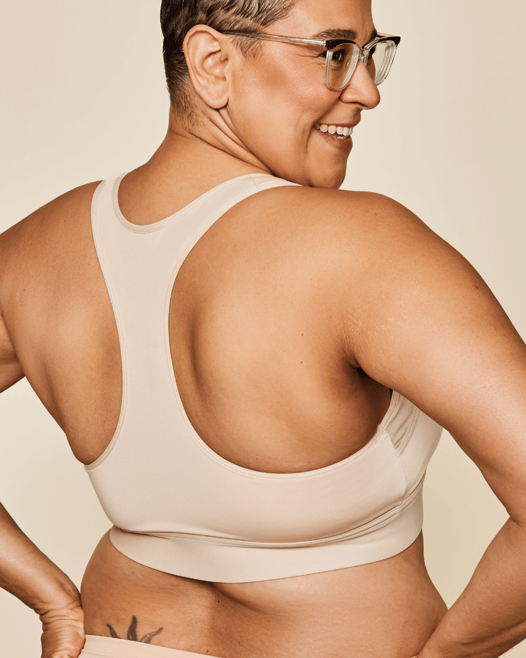 Meadow Hero front-closure sports bra in buff color, supportive athletic bra with front zipper and breathable fabric.