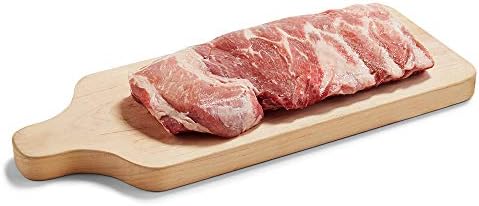 Frozen St. Louis pork ribs from Meat brand, showing raw, bone-in pork ribs with visible marbling and meat texture.