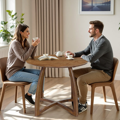 Natural wood Alma 36-inch round dining table by Megsu, showing smooth surface and sturdy wooden legs.