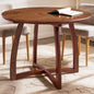Natural wood Alma 36-inch round dining table by Megsu, showcasing smooth surface and sturdy wooden legs.