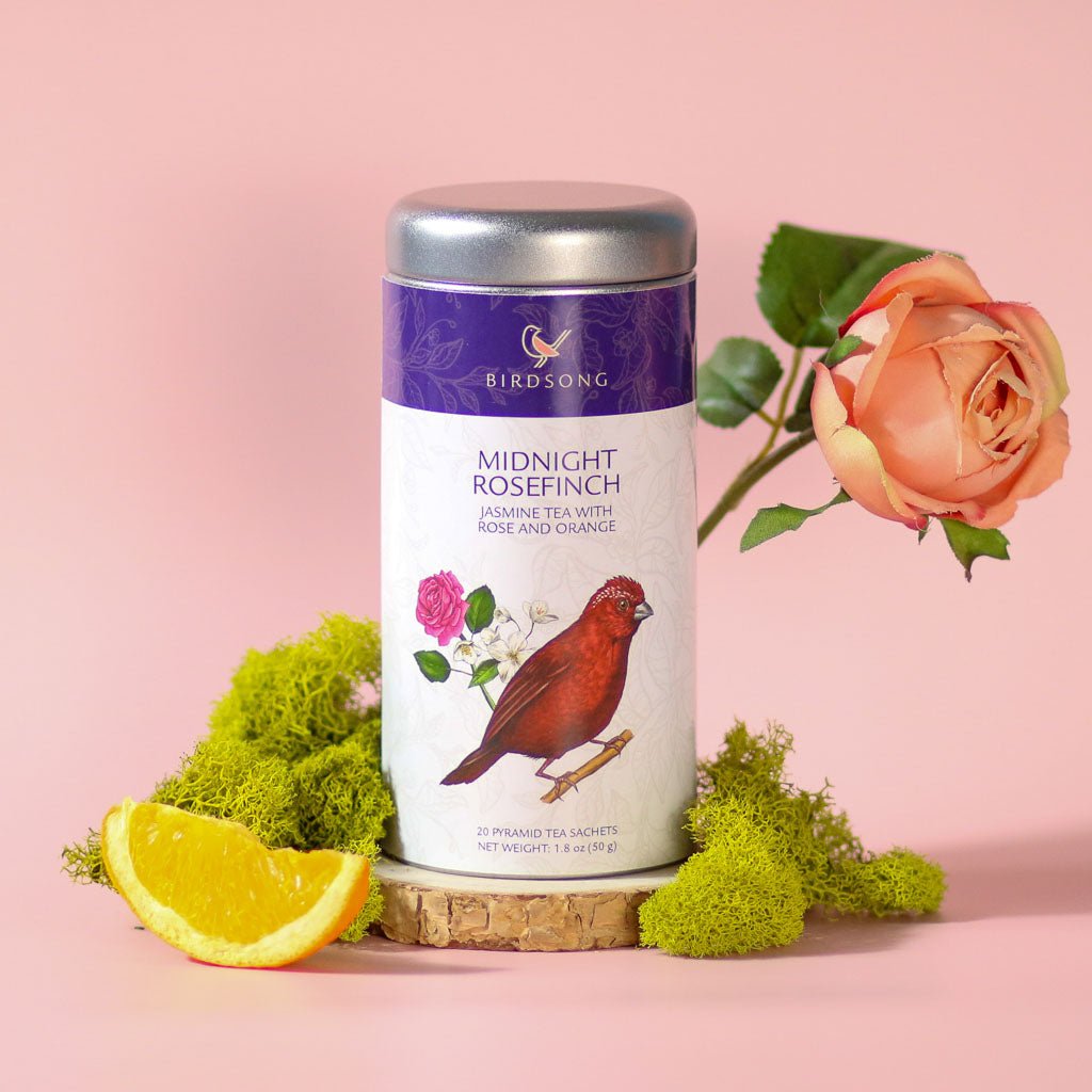 Green Jasmine Tea with orange from Birdsong Tea, featuring Midnight Rosefinch blend in a decorative teacup.