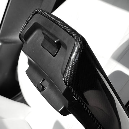 Tesla Model Y or 3 armrest cover made of dry carbon fiber, interior mod for a sleek, modern look.