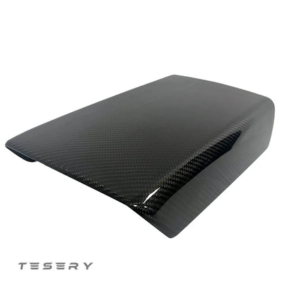 Tesla Model Y or 3 armrest cover in dry carbon fiber for interior modifications, showcasing sleek, textured carbon fiber material.