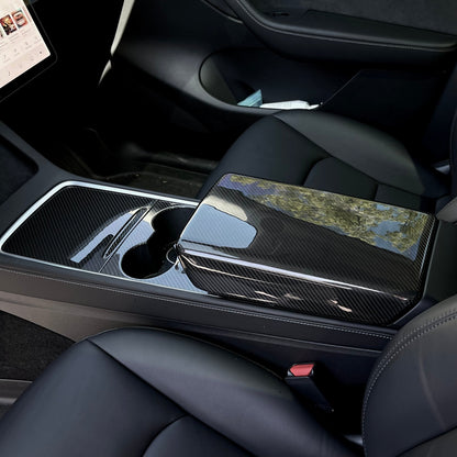 Tesla Model 3/Y armrest cover in dry carbon fiber for interior customization, featuring sleek and durable carbon fiber design.