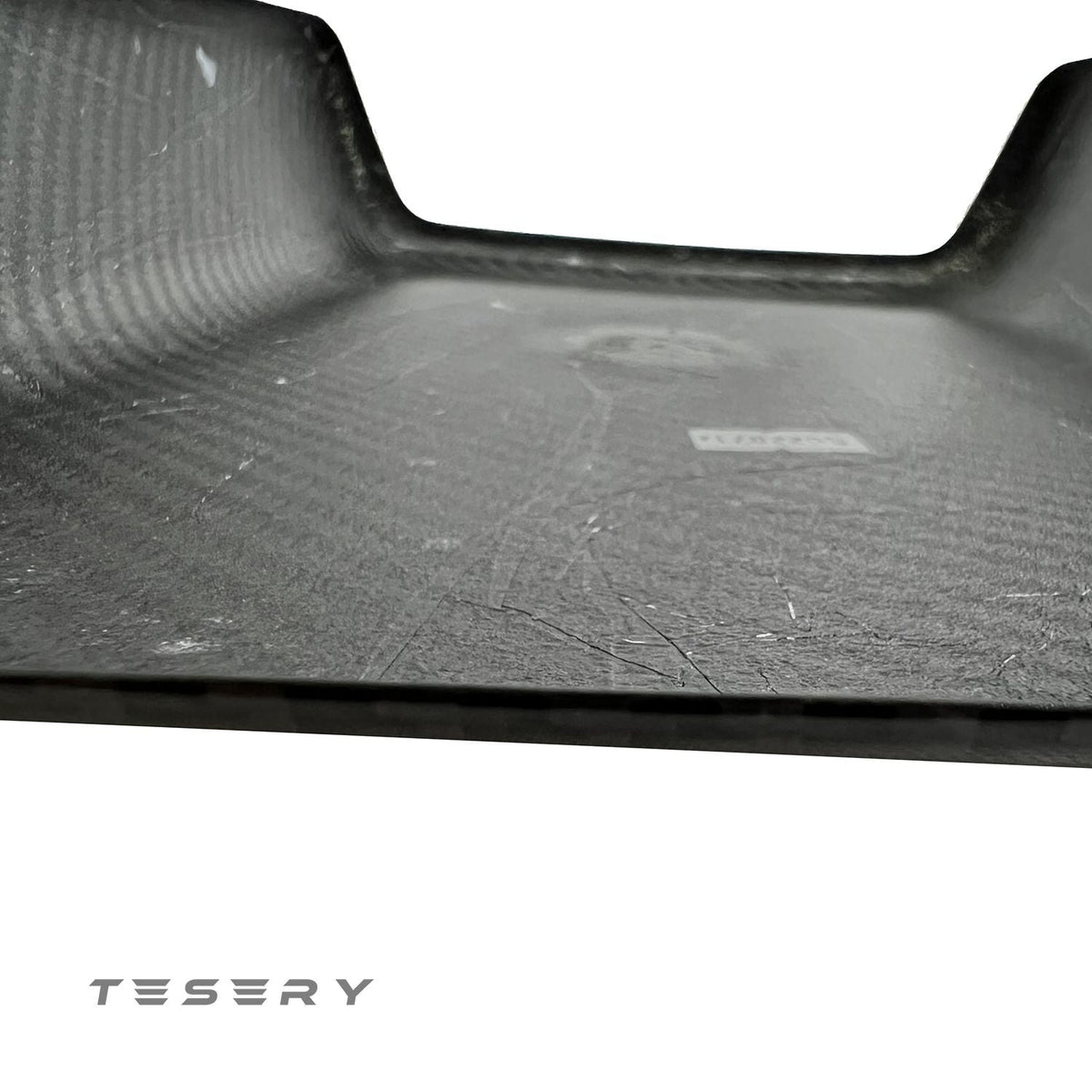 Tesla Model Y and 3 armrest cover in sleek dry carbon fiber, interior upgrade by Tesery for a modern, stylish look.