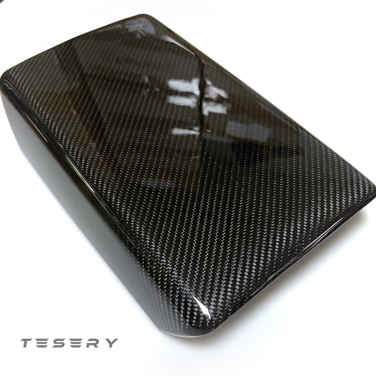 Tesla Model Y and 3 armrest cover made from sleek dry carbon fiber for interior upgrade, showcasing a stylish, high-quality finish.