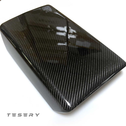Tesla Model Y and 3 armrest cover made from sleek dry carbon fiber for interior upgrade, showcasing a stylish, high-quality finish.