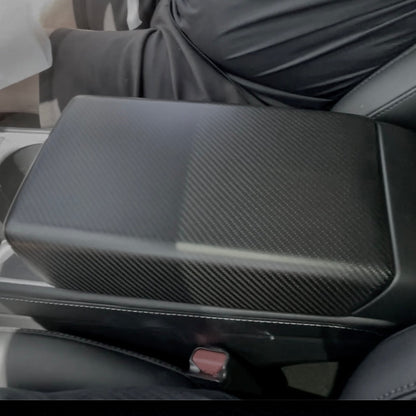 Tesla Model Y and Model 3 armrest cover in dry carbon fiber finish, interior upgrade by Tesery Official.