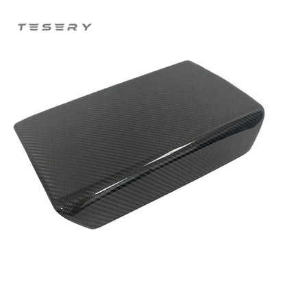 Tesla Model Y and 3 armrest cover in dry carbon fiber, interior mod by Tesery, showcasing sleek, textured carbon fiber finish.