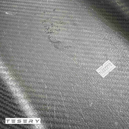 Tesla Model Y and 3 armrest cover made of dry carbon fiber, interior modification by TESERY with sleek, textured material.