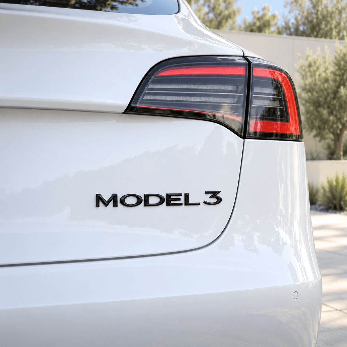 Tesla Model 3/Y/S/X tailgate emblem badge by Tesery, sleek car decal for Tesla models, enhances rear branding.