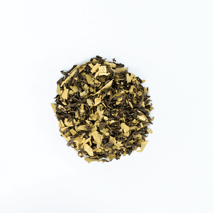 Organic Nepali Breakfast blend tea from Nepal Tea, featuring a steaming cup with tea leaves and traditional table setting.