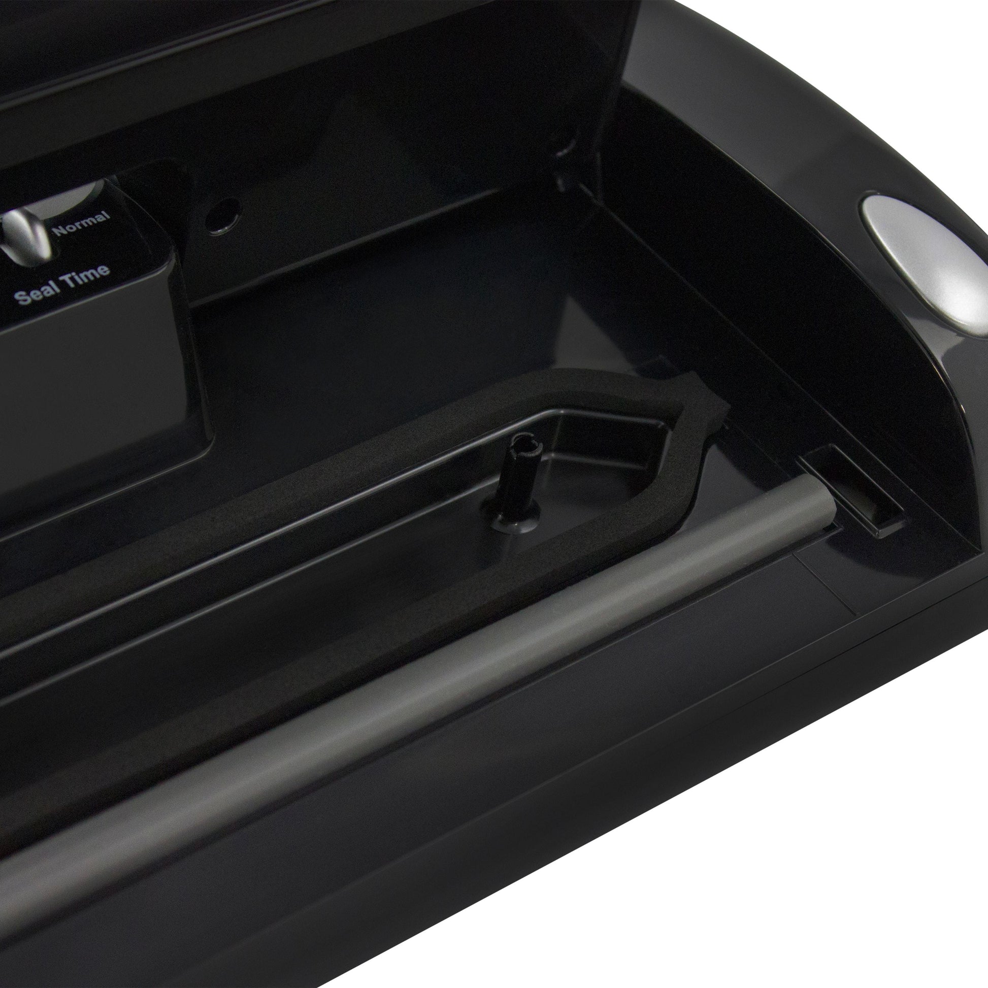 NESCO vacuum sealer machine with built-in roll storage, cutter, accessory port, and two 10 ft sealing rolls for food preservation.