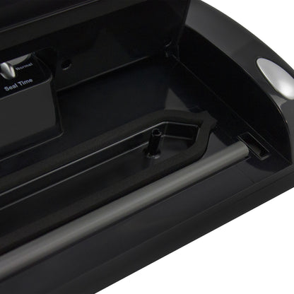 NESCO vacuum sealer machine with built-in roll storage, cutter, accessory port, and two 10 ft sealing rolls for food preservation.