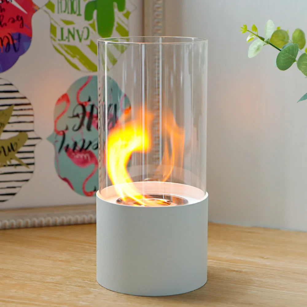 JHY DESIGN portable tabletop firepit with cylindrical design, glass enclosure, suitable for gel and ethanol flames.