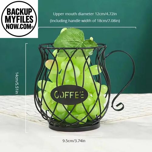 Black coffee pod holder in mug shape, with large capacity for organizing coffee pods and creamer containers on kitchen counter.