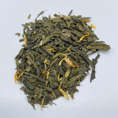 Fresh citron green loose leaf tea from Novel Tea Book Shop, showcasing vibrant green tea leaves with citrus aroma.