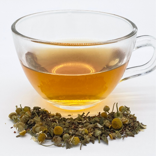 Loose leaf herbal Foxtrot Tea from Novel Tea Book Shop, showcasing fresh dried herbs in a natural tea blend.