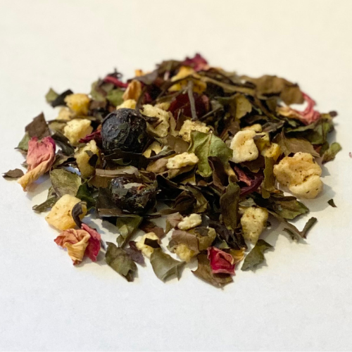 White Eternal Spring loose leaf white tea from Novel Tea Book Shop, fresh white tea leaves in a clear glass jar.