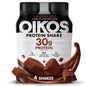 Four Oikos Chocolate Protein Shakes in 12 fl oz bottles, high protein, shelf-stable, ready-to-drink with 5g prebiotic fiber.