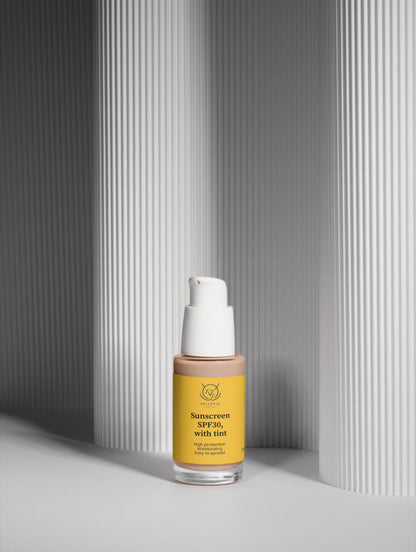 BelleVie Cosmétiques tinted mineral sunscreen SPF 30 with natural glow, shown in a tube suitable for daily UV protection.