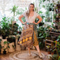 Boho plus-size sari wrap skirt made with eco-friendly yarn by Darn Good Yarn, featuring colorful crochet and knit details.