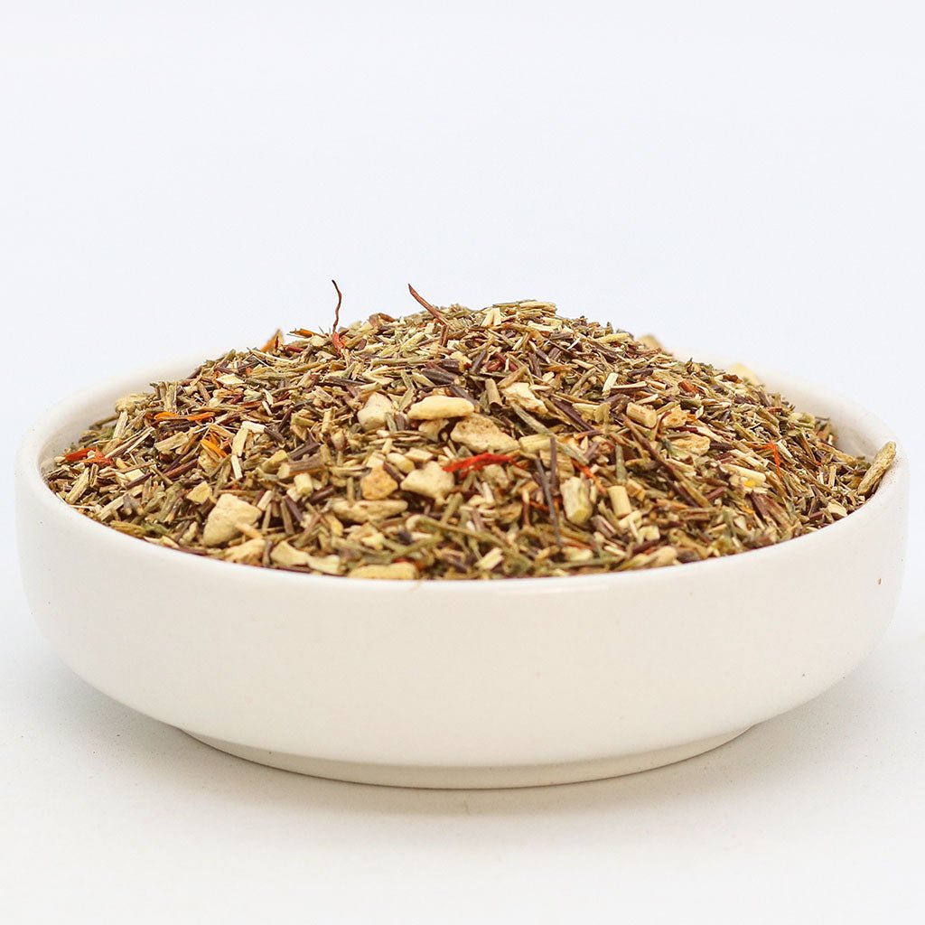 Orange Sugarbird herbal tea by Birdsong Tea featuring vibrant orange and green rooibos leaves in a tea blend.