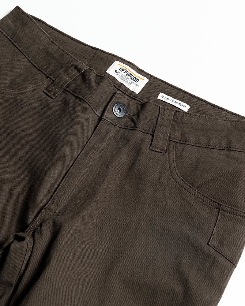 Dark brown Off The Grid Surplus Trailblazer Standard Fit Pants shown on a model, featuring a relaxed fit and durable fabric.