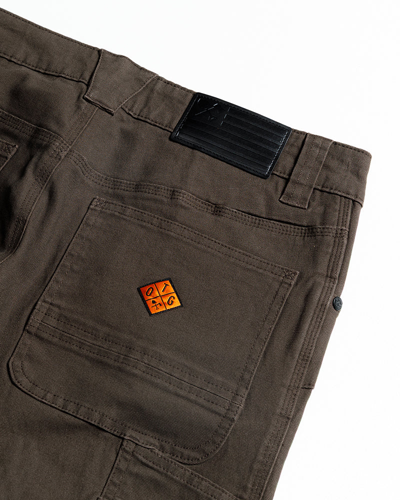 Dark brown Off The Grid Surplus Trailblazer standard fit pants laid flat, showcasing durable fabric and classic design.