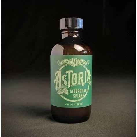 Moon Soaps Astoria Aftershave Splash in a 4 oz bottle, featuring a clear liquid and label with natural ingredients and branding.