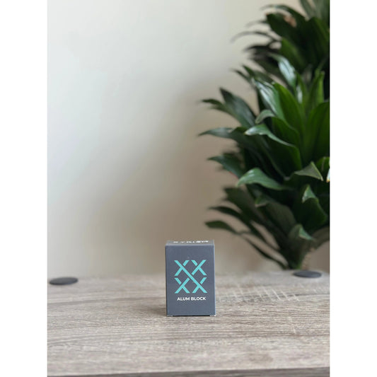 XYRISM Alum Block 100g by Pasteur Pharmacy, natural mineral stone for skincare and deodorant use, shown in the image.