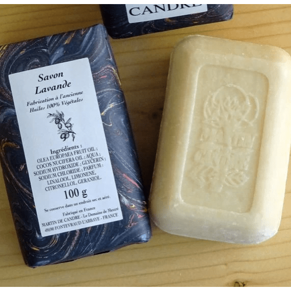 Martin de Candre single solid bar soap collection in 100g and 250g sizes, featuring benjoin scent, displayed in a natural setting.