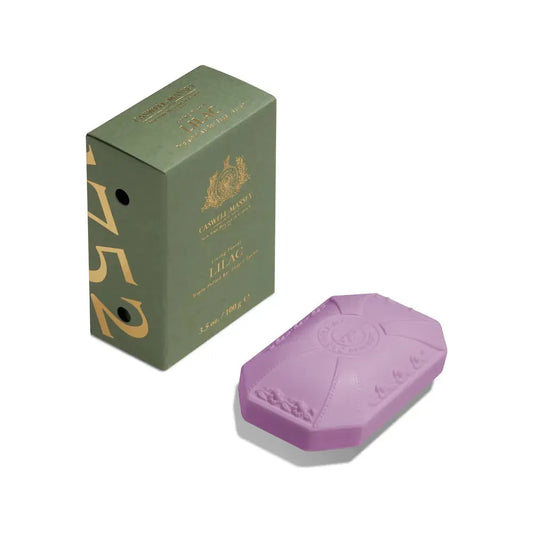 Triple-milled Caswell Massey bar soap with classic lilac scent, 3.5 oz, featuring a elegant soap collection in natural setting.