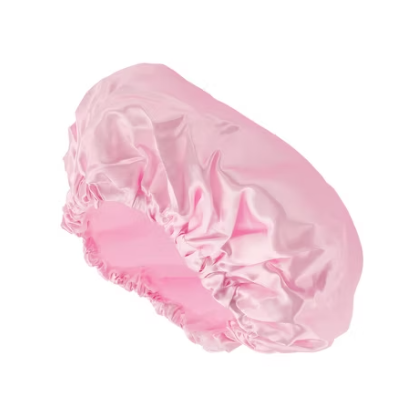 Pink LA Indulgence waterproof shower cap from Pasteur Pharmacy, designed for bath and body use, with a comfortable, snug fit.