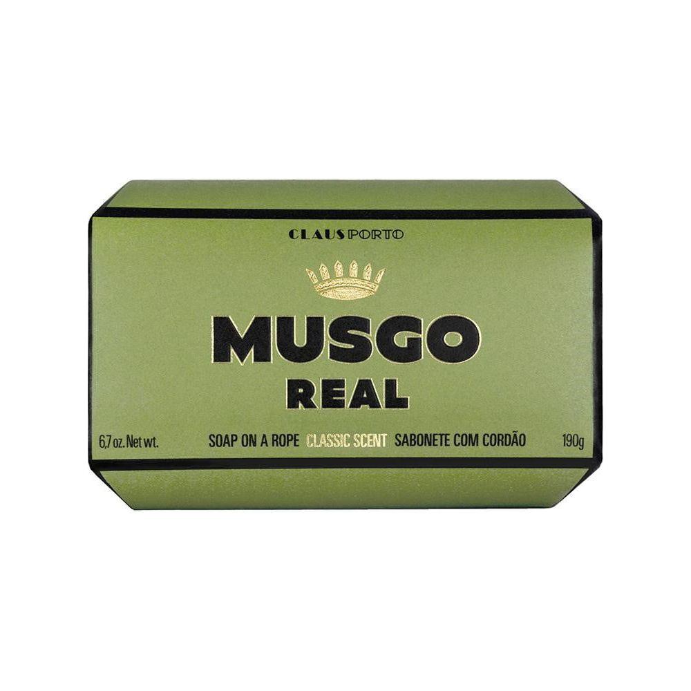 Musgo Real soap on a rope by Pasteur Pharmacy, classic-scent bath soap in a 6.7 oz size, hanging with textured surface.