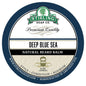 Deep Blue Sea natural beard balm by Stirling Soap Co. in a 2 oz jar, featuring a calming blue label and beard grooming ingredients.