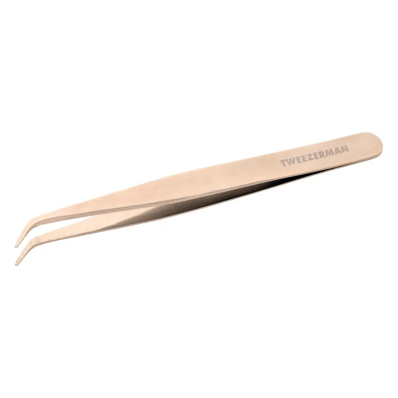 Tweezerman Lash Assist Rose beauty tool shown with pink handle and precision tip for eyelash separation and enhancement.