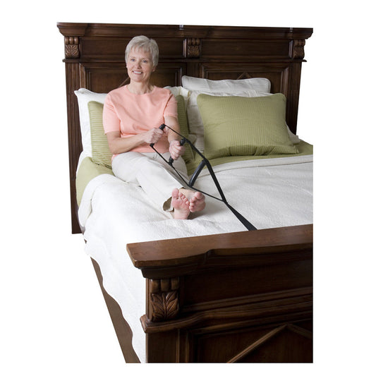 Stander Bed Caddie from Pasteur Pharmacy with multiple pockets for organizing bedside essentials on a bed.