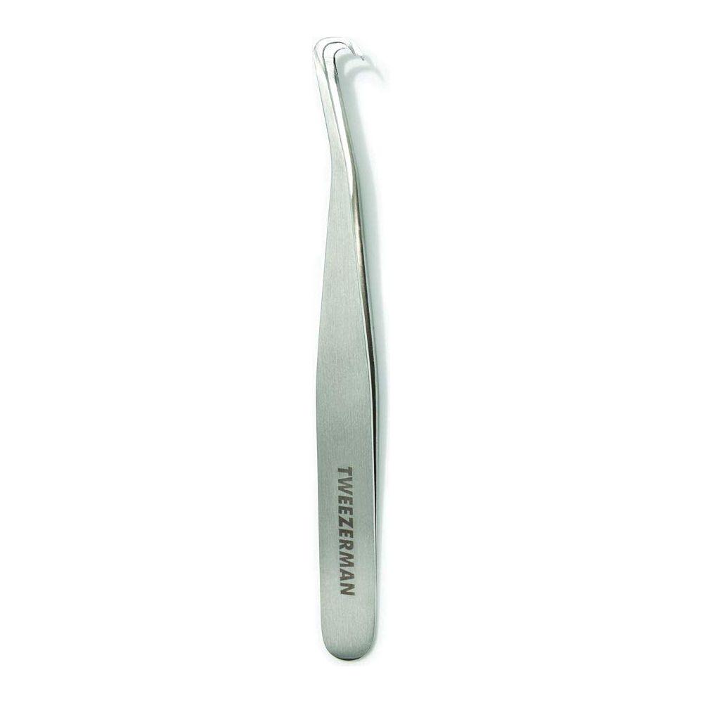 Tweezerman blackhead extractor tool for acne removal, featuring a stainless steel loop design for skin cleansing.