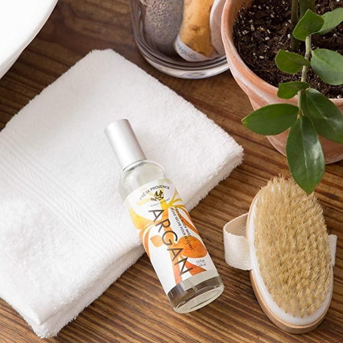 Pre De Provence Argan Sweet Orange Dry Oil Body Mist in 100ml spray bottle, featuring a floral orange scent and nourishing formula.