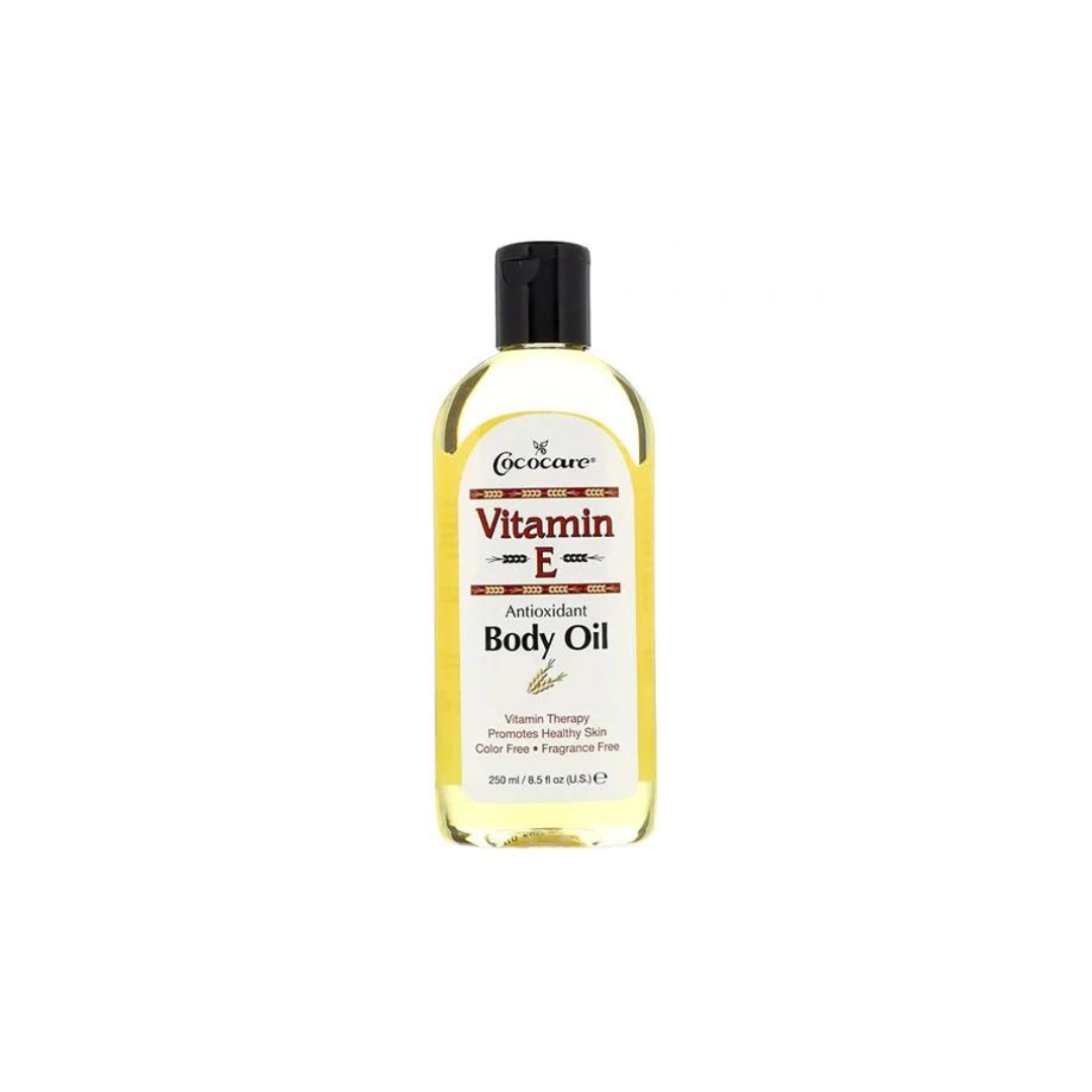 Pasteur Pharmacy Cococare Vitamin E Antioxidant Body Oil in a 9 fl oz bottle, showing the body oil with a smooth, nourishing texture.