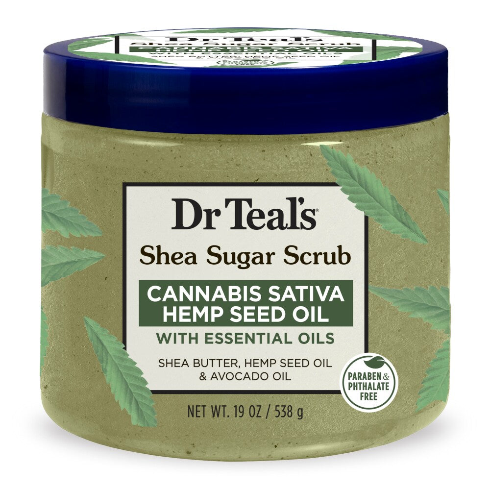 Dr Teal's Cannabis Sativa Hemp Seed Oil Shea Sugar Body Scrub, 19 oz, in a tub showing creamy texture with natural ingredients.